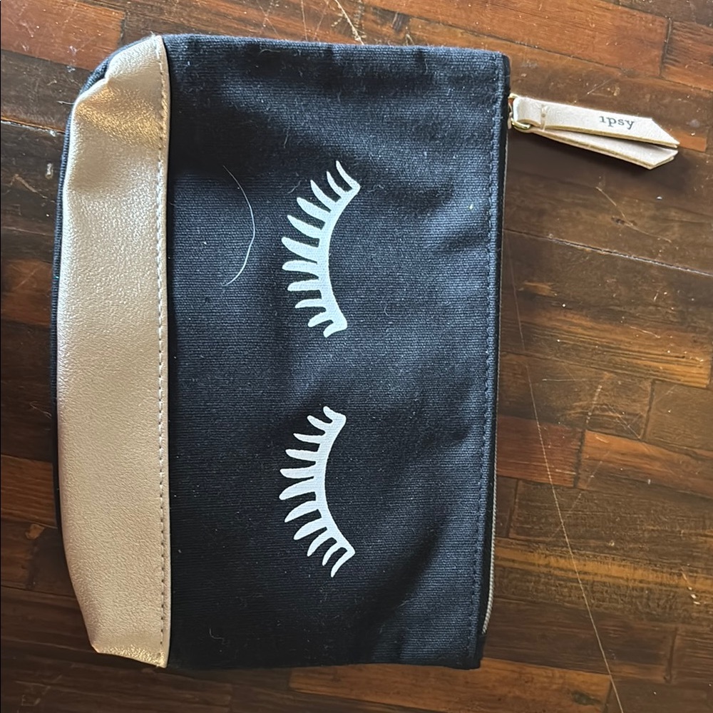 Ipsy Black Pouch with Gold Trim and Eyelash Design